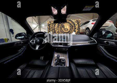 BMW X7 cockpit with digital cluster, crystal gear selector, ambient LEDs Stock Photo