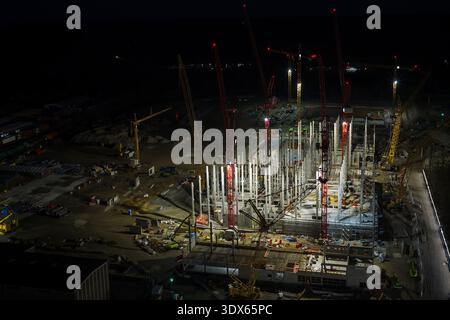 Drone footage of a construction site at night. Stock Photo