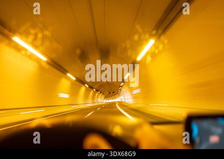 Abstract speed blur inside highway tunnel Stock Photo