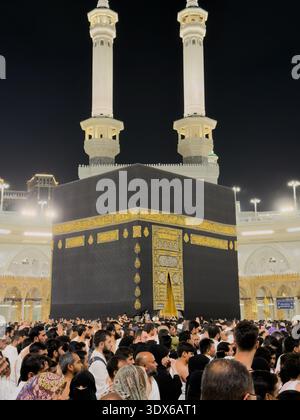 Pilgrims praying around the Kaaba at the Grand Mosque in Mecca during