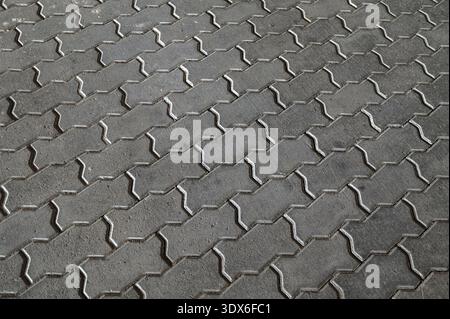 Texture of concrete pavement or sidewalk with paving slabs.Grey paving slabs as a background close-up image. Stock Photo