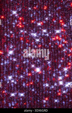Abstract glowing background featuring a vibrant bokeh effect with a seamless blend of red and white glitter. Ideal for festive and celebratory designs Stock Photo
