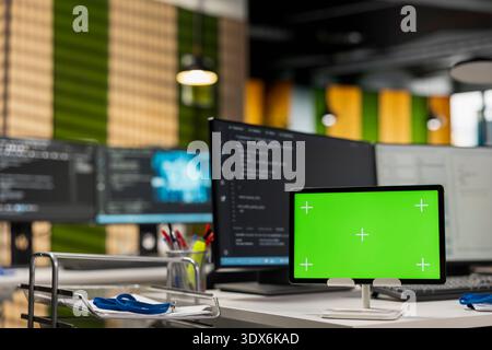 Green screen tablet running advanced AI algorithms in empty startup office. Artificial intelligence coding platform used to deploy deep learning models on chroma key device Stock Photo