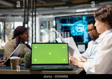 Isolated screen laptop used by software developers doing brainstorming to create AI models. IT experts cooperating on large language model artificial intelligence project using mockup notebook Stock Photo