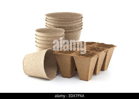 Biodegradable peat seed pots and starter tray photographed on white background, perfect for eco-friendly gardening, starting seedlings, transplanting Stock Photo