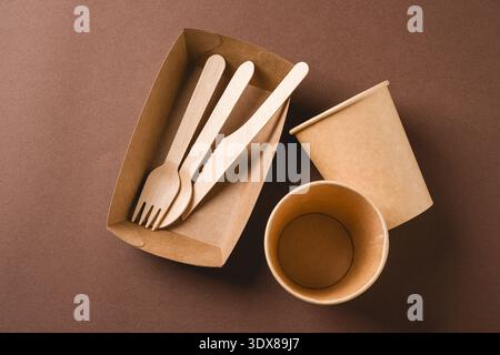 Eco takeaway packaging with wooden cutlery and paper cups Stock Photo