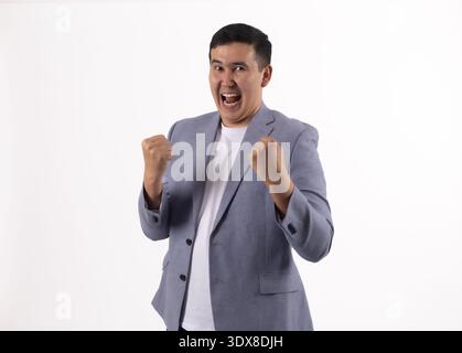 Excited businessman shouting with joy on white background Stock Photo