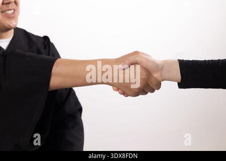 Close up of a judge shaking hands with a client in court Stock Photo