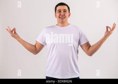 Man gesturing with open hands on white background Stock Photo