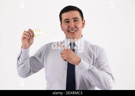 Businessman holding a white business card on white background Stock Photo