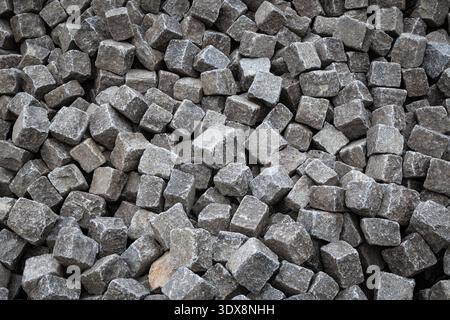 Granite cobblestone blocks background. Pile of square pavement stones in Nessebar, Burgas, Bulgaria Stock Photo