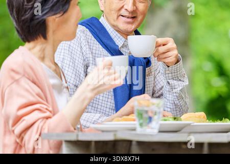 Senior couple having breakfast on the terrace Stock Photo