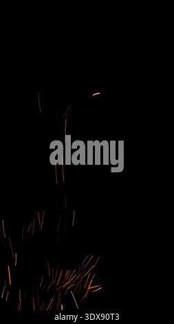 fire flames of campfire with sparks over black background, for overlay Stock Photo