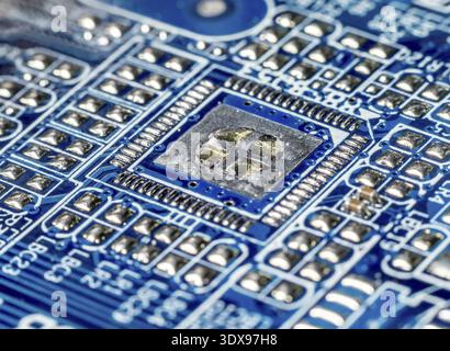 Closeup of electronic elements embedded into PCB board Stock Photo