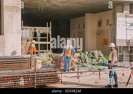 3 December 2025, Bahrain, Manama: Workers developing urban utilities ...