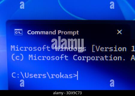 Close-up of Windows Command Prompt terminal on a blue screen displaying the user directory path, concept for system administration and computer progra Stock Photo