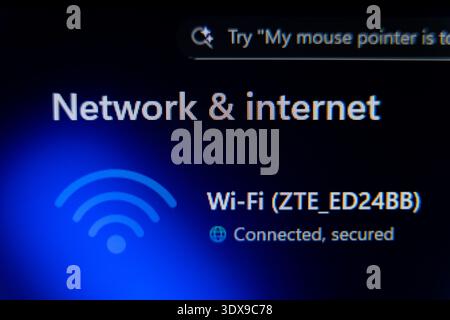 Windows Network and Internet settings interface showing active Wi-Fi connection status with secured signal icon, home office wireless connectivity and Stock Photo