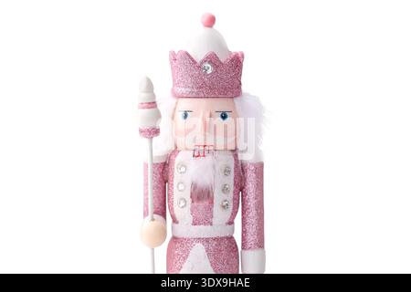 Simple pink nutcracker figurine isolated on transparent background clipart with crown and minimal decoration Stock Photo