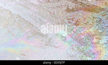 Oil spilled on melting snow. Stock Photo