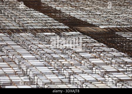 Reinforced Concrete Foundation with Steel Rebar Mesh and White Styrofoam Insulation Blocks, Construction Site Floor Preparation Background Stock Photo