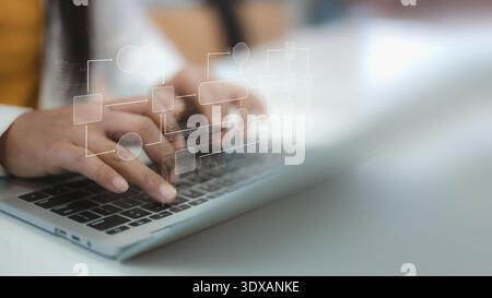 Close up of person hands typing on laptop keyboard with digital flowchart and coding script. Concept of business process automation, software developm Stock Photo
