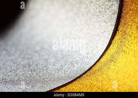 Abstract Glitter Wallpaper, Background Silver Gold Glitter Curve Closeup Revealing Warm Cool Metallic Tones, Fine Granular Shimmer Curved Fold Stock Photo