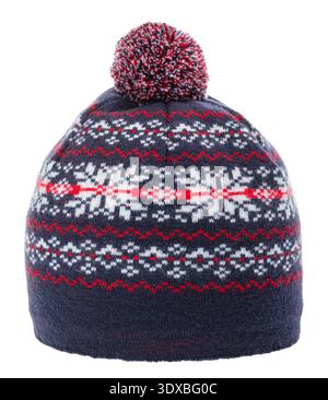 Navy knit beanie with pom pom isolated on white, featuring red and white snowflake pattern for cozy winter fashion and holiday style Stock Photo
