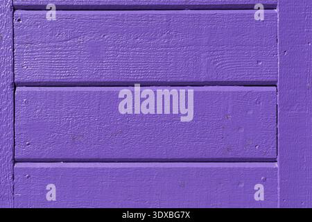 Purple wooden panel wall with painted boards and textured surface detail. Stock Photo