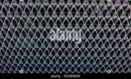 Aerial view of a geometric patterned facade creates a mesmerizing play of light and shadow, showcasing intricate design elements, Los Angeles, Califor Stock Photo