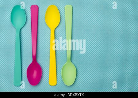 Multi Colored Spoons on a Spring Background Stock Photo