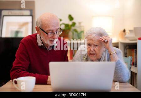 Old people having problem with laptop. Old people having problem with laptop. Digital literacy. model released Stock Photo