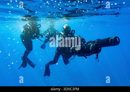 U.S. East coast-based Naval Special Warfare Operators (SEALs) conduct dive operations to increase maritime lethality during training off the coast of Key Largo, Florida, Feb. 18, 2025. Naval Special Warfare Group TWO produces, supports, and deploys the world's most lethal maritime special operation forces to ensure the United States will deter and win wars.   Editorial Use Only. Not for Endorsement. Credit: U.S. Navy / Petty Officer 1st Class Katie Cox. Stock Photo