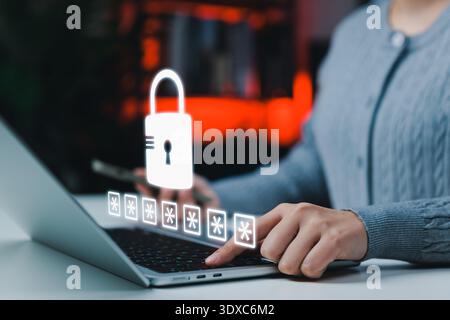 Data privacy and cybersecurity concept with person typing password on laptop keyboard. Virtual padlock interface representing secure login, authentica Stock Photo