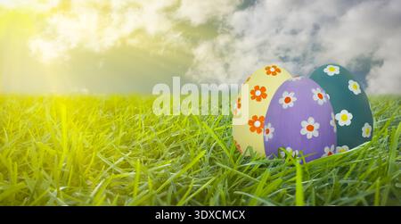 Easter eggs with floral patterns in green spring grass Stock Photo