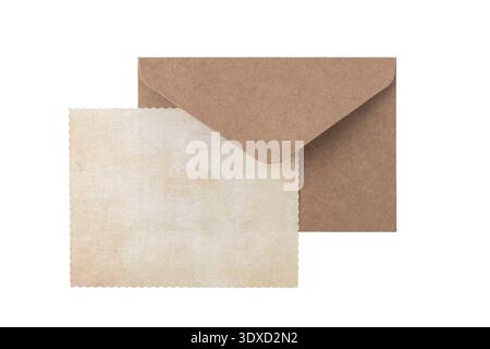 Blank grunge paper card and brown retro envelope isolated on white background Stock Photo