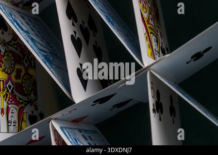 A fragile house-of-cards balance in a precarious structure near collapse. Stock Photo