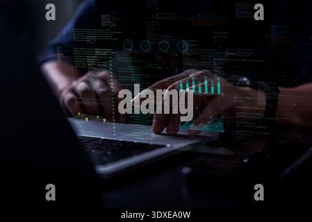 Programmer analyzing complex digital data using futuristic technology interface laptop. High tech concept for software development, cyber security, gl Stock Photo