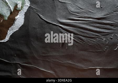 Grungy Street Poster Texture with Ripped Corner and Wet Glue Creases Stock Photo