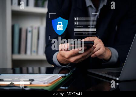 Man login password authentication using smartphone. Secure access data protection cybersecurity. Businessman virtual shield icon privacy technology. O Stock Photo
