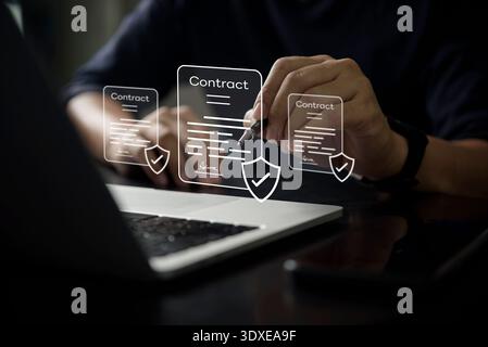 Businessman signing digital contract on laptop using electronic signature technology for secure online agreement and paperless workflow. Concept of di Stock Photo