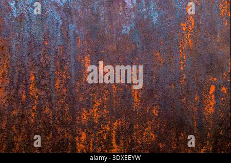 Rusty metal texture or rusty metal background. Grunge retro vintage of rusty metal plate for design with copy space for text or image. Dark edged. Stock Photo