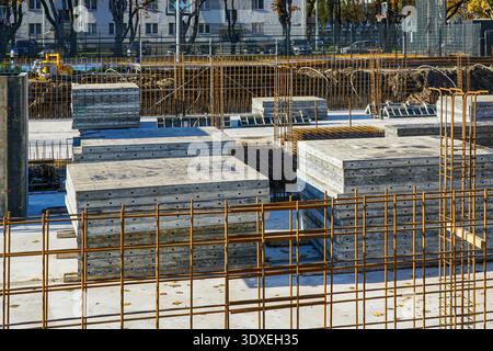 Reinforced Concrete Foundation and Rebar Framework at Urban Construction Site Stock Photo