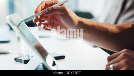 Person, hands or writing with tablet in office for web design, drawing or sketching on desk. Closeup, creative or designer with pen or technology for Stock Photo