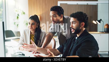 Man, team and surprise with computer at startup, notification or excited for deal at media company. People, group and wow with pc, happy and Stock Photo