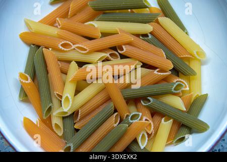 Tri color pasta noddles close up. Stock Photo