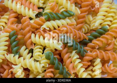 Tri color pasta noddles close up. Stock Photo