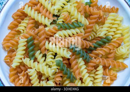 Tri color pasta noddles close up. Stock Photo