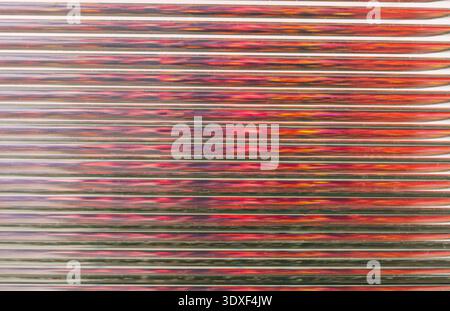 Abstract red striped background reflecting horizontal lines Stock Photo