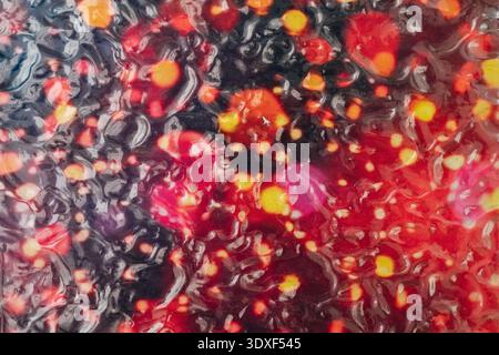 Abstract red and black texture with liquid bubbles Stock Photo