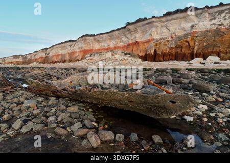 Hunstanton, Norfolk, UK. Wreck of the T S Sheraton on the beach below the red and white cliffs of Hunstanton, North Norfolk, England, UK Stock Photo